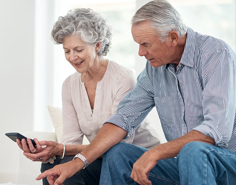 people looking at a phone